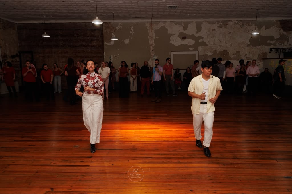 Salsa dancing during a group dance event