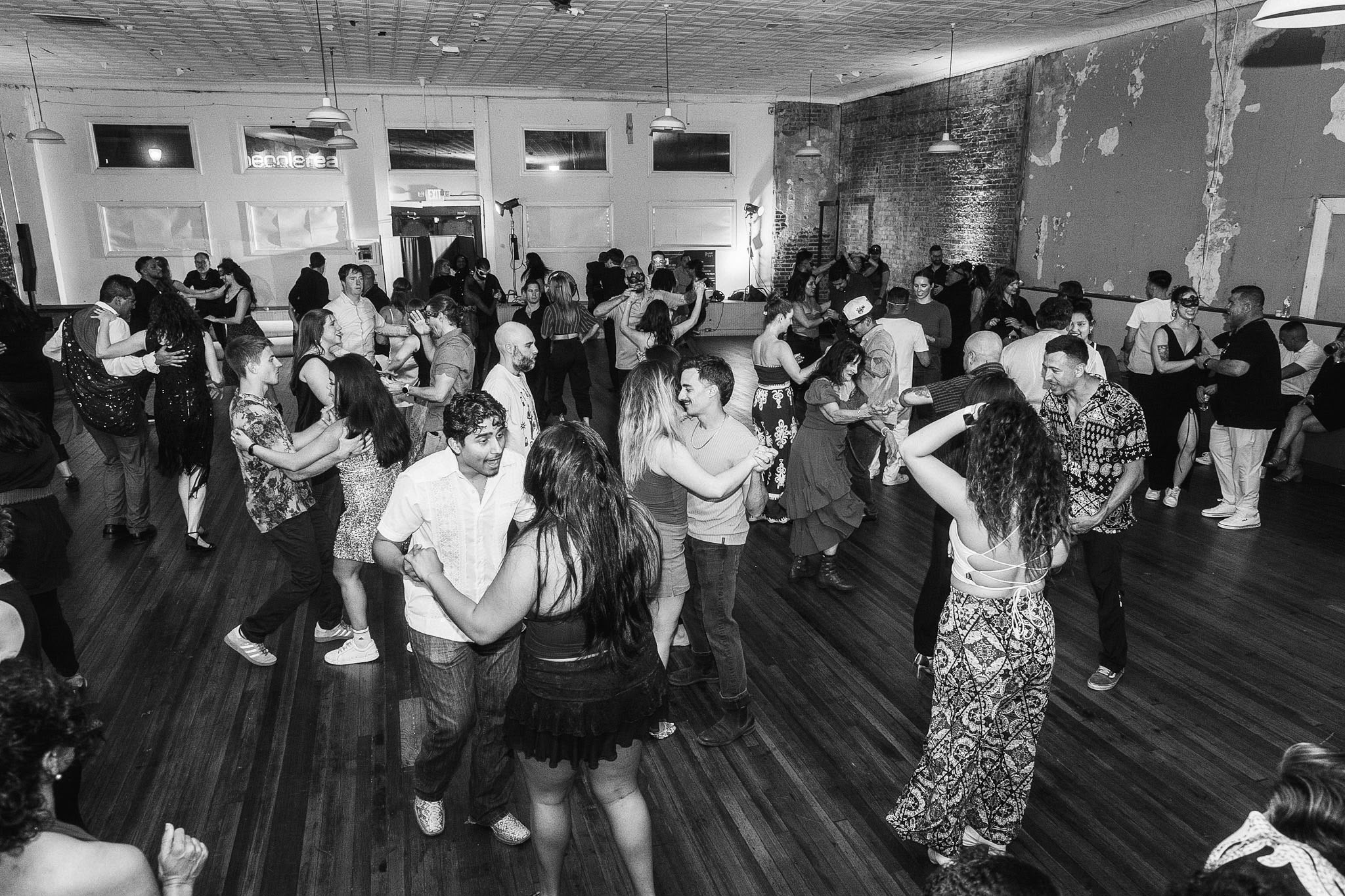 Friends enjoying a social salsa and bachata dance event