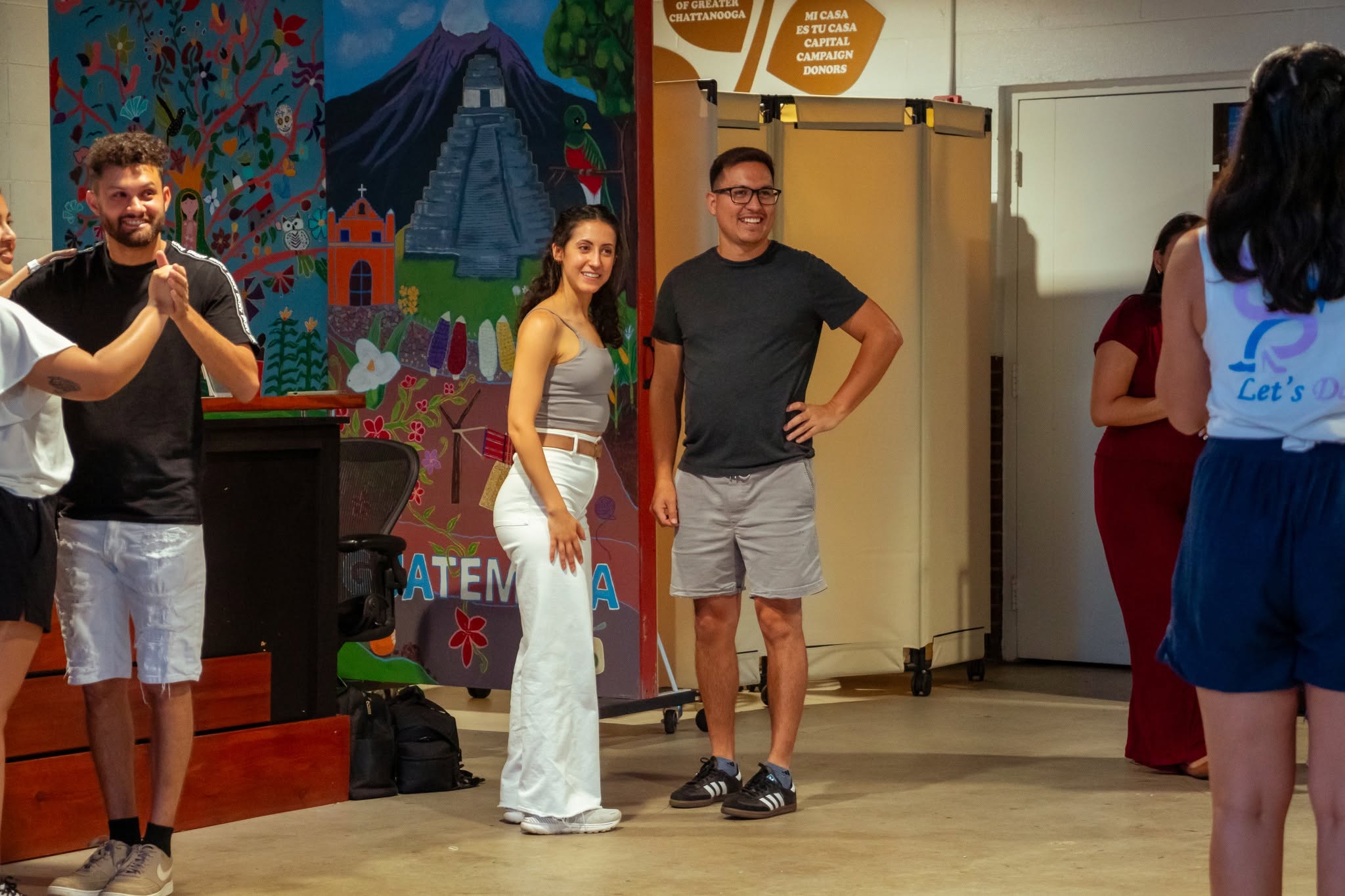 Salsa dancers enjoying a group dance experience