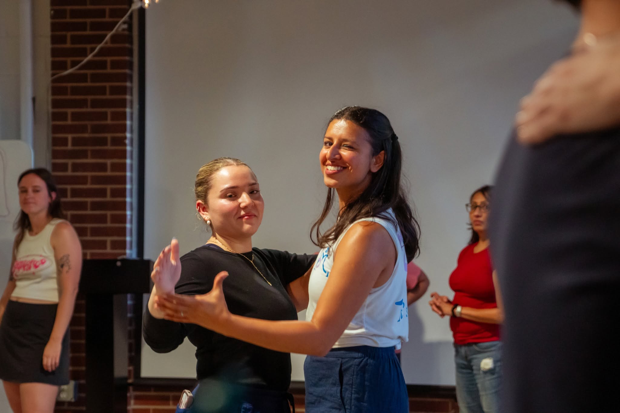 Sonia guiding students during a dance class